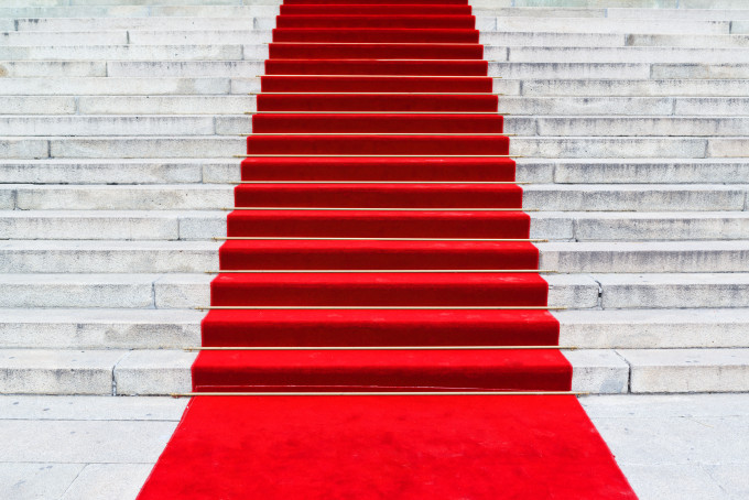 Celebrities often fly by private jet charters to red carpet events