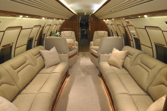The roomy, luxurious interior of a private business jet