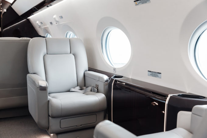 Luxury interior in bright colors of genuine leather in the business jet