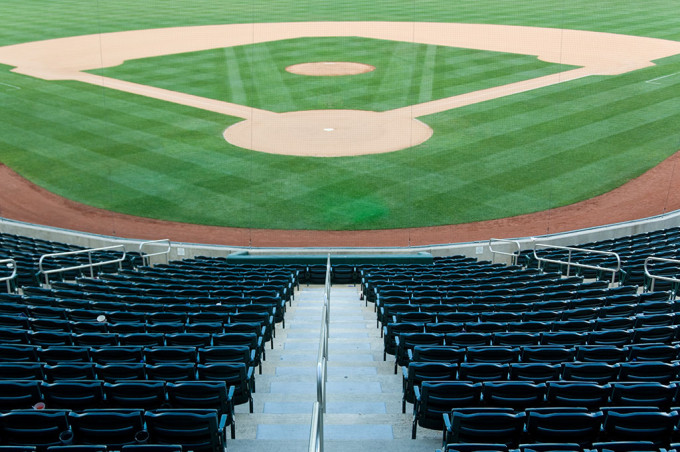 A pristine baseball stadium waiting for fans. 