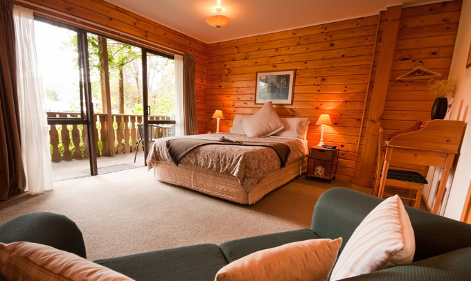 A look at a rustic bedroom of a wilderness lodge.