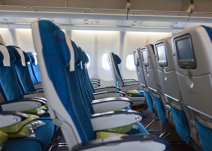 The packed like sardines interior of a commercial airline