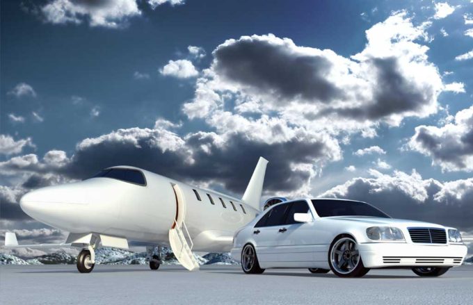 Car waiting outside of private jet.