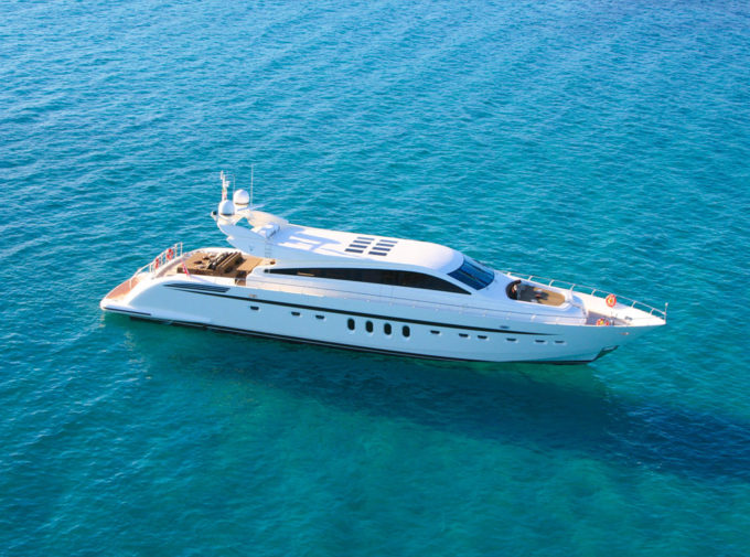 Aerial view of a luxurious yacht at sea. 