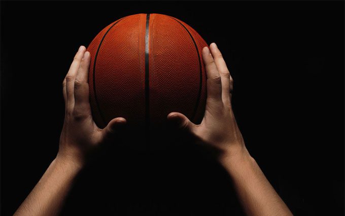 Basketball Ball in Male Hands