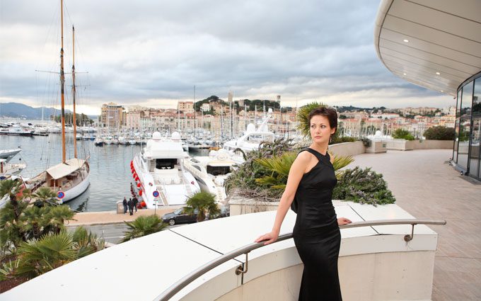 Beautiful model on the balcony of Palais des Festivals in Cannes