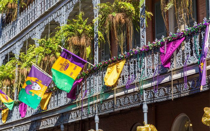 ronwork galleries on the Streets of French Quarter decorated for Mardi Gras in New Orleans, Louisiana